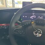 car keys on steering wheel
